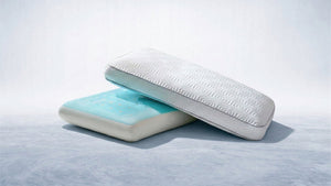 White patterned pillow over a blue cooling gel pillow, creating a clean look for cool, comfortable sleep.