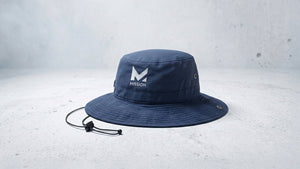 Stylish navy blue Mission cooling bucket hat, perfect for active adventures and sun protection.