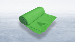 Bright green Alphacool cooling towel on an icy white background, essential for refreshing comfort during golf.
