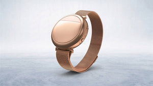 Rose gold cooling wearable with mesh strap, offering elegant support for menopausal well-being.