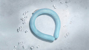Innovative light blue neck cooler amidst ice cubes, evoking instant, refreshing cool relief.