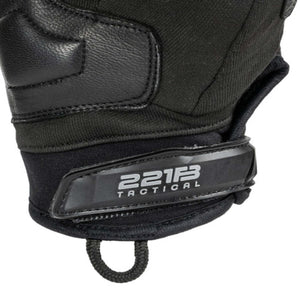 Black Warrior glove by 221B Tactical, with padded knuckle areas and a wrist strap displaying the brand logo.