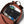A lightweight rust-colored daypack by Bellroy, its interior showing an organized compartment with a magazine, snack, black pouch, white container, and blue kit.