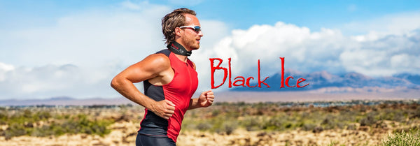 A man in a red top runs through a sunny desert wearing a Black Ice cooling collar, with large red 