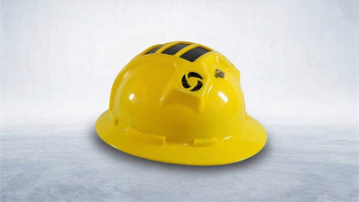 A bright yellow, full-brimmed hard hat with black vents on top, a circular side vent with a black fan-blade logo, and a 