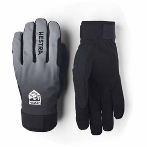 Five-finger ski gloves by Hestra, one gray gradient with a logo, the other solid black with wrist straps.
