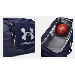 Navy blue duffle bag by Under Armour, with white logo, silver keys, and an open view revealing a red basketball.