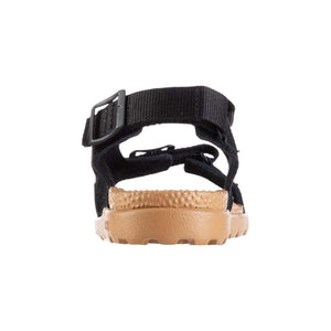 Black sport sandal by Acorn with a tan textured Everywear sole and adjustable strap with a buckle, back view.