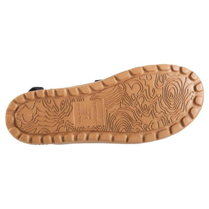 Brown slide sandal by Acorn, featuring a textured Everywear sole with a wavy grip pattern and visible size US 6.