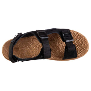 Black sport sandal by Acorn with three adjustable webbing straps and a textured tan footbed, overhead view.