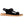 Black suede sport sandal for women by Acorn with adjustable straps, tan sole with Acorn logo, and textured footbed, side view.