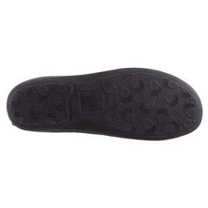 Black slipper sole by Acorn, bottom view, with an acorn and leaf tread pattern and visible brand logo.