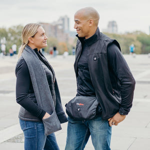 Gray heated fleece scarf with pockets by ActionHeat, worn by a woman outdoors.