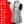 Light gray women's battery-heated puffer vest by ActionHeat, with black zippers, a chest logo, and an accompanying power bank.