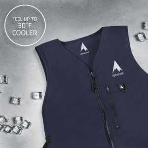 Navy blue cooling vest by AlphaCool with front zipper, pocket, white mountain logo, illuminated power button, and scattered ice cubes.