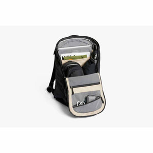 Black open Venture Ready Pack by Bellroy showing organized interior with laptop, pouches, and cables.