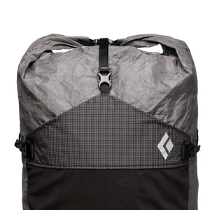 Grey and black backpack by Black Diamond with a roll-top closure, grid pattern, and white diamond logo.