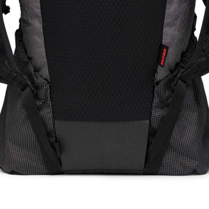 Black and grey backpack by Black Diamond with a black textured panel, grid pattern, and red ULTRA tag.