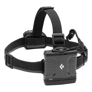 Graphite-colored headlamp by Black Diamond with a separate rectangular battery pack featuring a diamond logo and 'ICON' text, connected by a coiled cord.