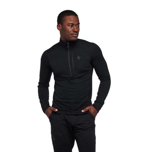 Black men's quarter-zip pullover by Black Diamond with a stand-up collar and zippered chest pocket, worn by a man.