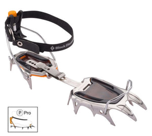 Silver metal strap crampons with black webbing and an orange adjustment knob by Black Diamond, shown angled to display spikes and adjustable length.