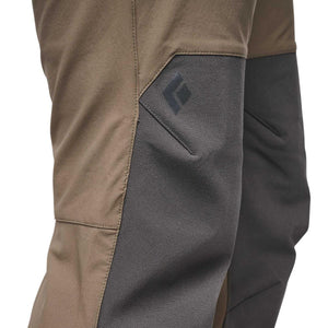Women's Alpine Hybrid Pant by Black Diamond, a cropped view showing two-tone khaki and dark grey fabric, with a textured knee panel and logo.