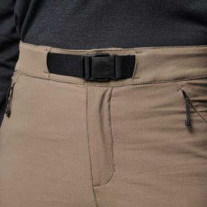 Khaki women's Alpine Hybrid Pant by Black Diamond with a black web belt and quick-release buckle, worn with a dark gray shirt.