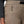 Women's taupe Alpine Hybrid Pant by Black Diamond, showing a zippered thigh pocket with braided pull and black belt detail.