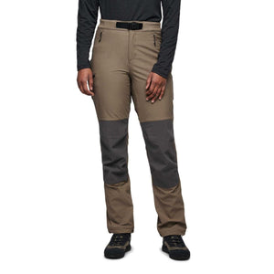 Brown and gray women's hybrid pant by Black Diamond, with a black integrated belt and reinforced knee panels, worn by a person.