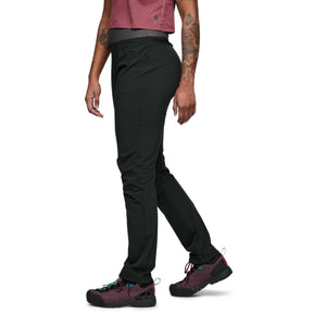 Black women's Alpine Light Pant by Black Diamond, a side view on a person walking, featuring an elastic waistband.