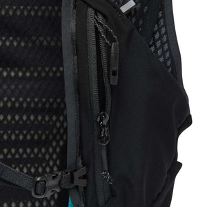 Black backpack by Black Diamond, showing a diamond mesh back panel, a zippered pocket with a whistle, and an adjustable strap.