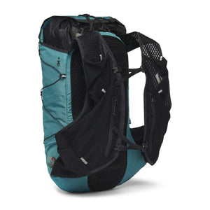 Teal and black ripstop backpack by Black Diamond with vest-style shoulder straps, mesh back, and a visible roll-top closure, shown from the side.
