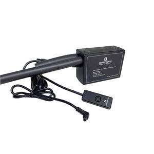 Black dual backpack ice water cooling system by CompCooler with two tubes, a coiled cable, and a remote control unit.