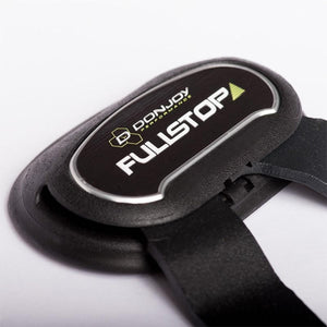 Black knee brace with silver trim by DonJoy, featuring "FULLSTOP" text and an adjustable strap.