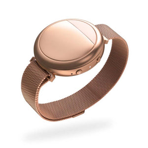 Rose gold wearable device by Embr Wave with a metallic mesh band, featuring a smooth face with a diagonal line.