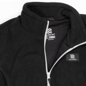 Black fleece heated vest by Mobile Warming featuring a stand-up collar, silver zipper, and Fieldsheer logo.