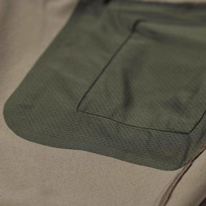 Men's Abisko Trail Stretch Trouser by FjallRaven in tan with an olive green mesh leg pocket detail.