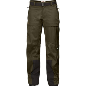 Dark olive green women's shell trousers by FjallRaven, with black reinforced knees and cuffs, a black belt, and zippered pockets.