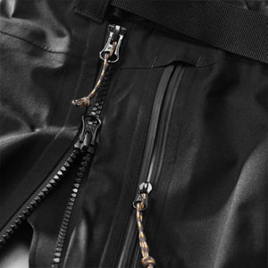 Black Women's Keb Eco-Shell Trousers by FjallRaven, with two technical zippers and textured paracord pullers.