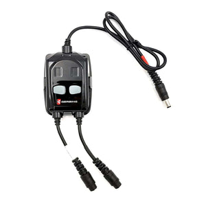 A black 12V dual wireless controller by Gerbing with two gray control buttons and multiple cables.