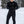 Black Men's FlexCore Heated Base Layer Pant by Gobi Heat with visible dual control buttons, worn outdoors in snow.