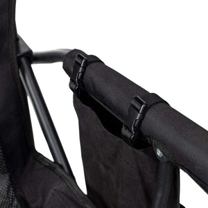 Onyx camp chair by Gobi Heat, showing black fabric armrest with attached side pocket and buckles.