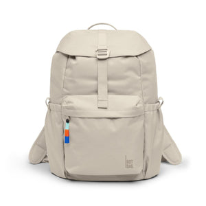 Light beige Flap Pack backpack by Got Bag, front view, with top flap, buckle strap, colorful zipper pull, and brand logo.