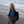 Dark blue padded tote bag by Got Bag carried by a woman in a blue hoodie on a sunny beach.