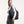 Black padded tote bag by Got Bag, carried over a woman's shoulder, wearing a white long-sleeve top.