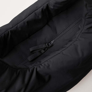 Black padded tote bag by Got Bag with an angled view of an internal zippered pocket and fabric pull.