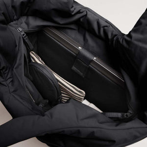 Black Tote Bag by Got Bag, open revealing a laptop in a padded sleeve and a striped pouch.