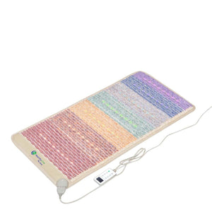 Rainbow Chakra mat by HealthyLine, textured with multicolored sections, embedded lights, and an attached controller, angled view.