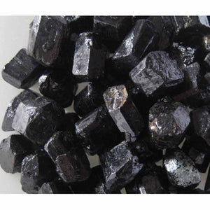 Black Tourmaline Magnetic Hematite Energy Comforter by HealthyLine, featuring rough, dark black crystalline stones.