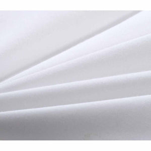 White silk comforter by HealthyLine with soft, flowing folds.